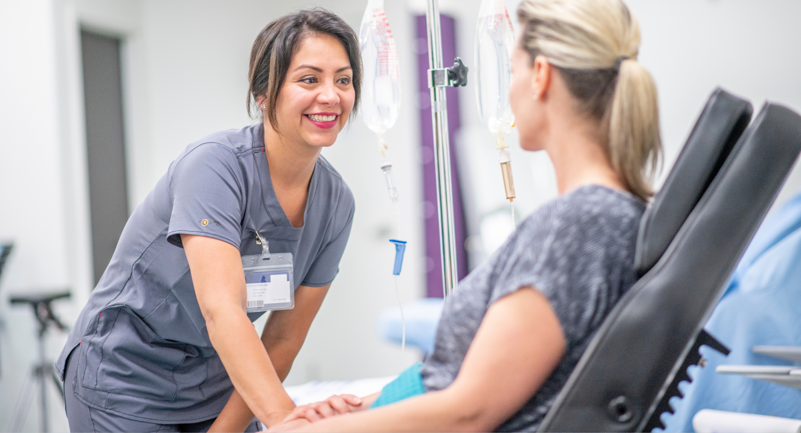 Clinician preparing an IV treatment for a patient