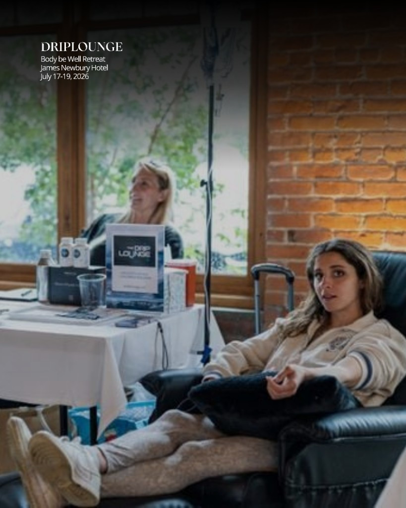 Clinician administering an IV treatment at the Drip Lounge station during the Body be Well Retreat