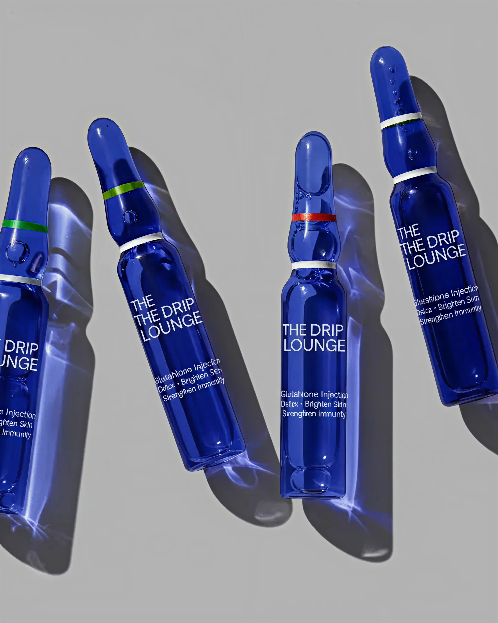 Drip Lounge branded wellness products in grayscale